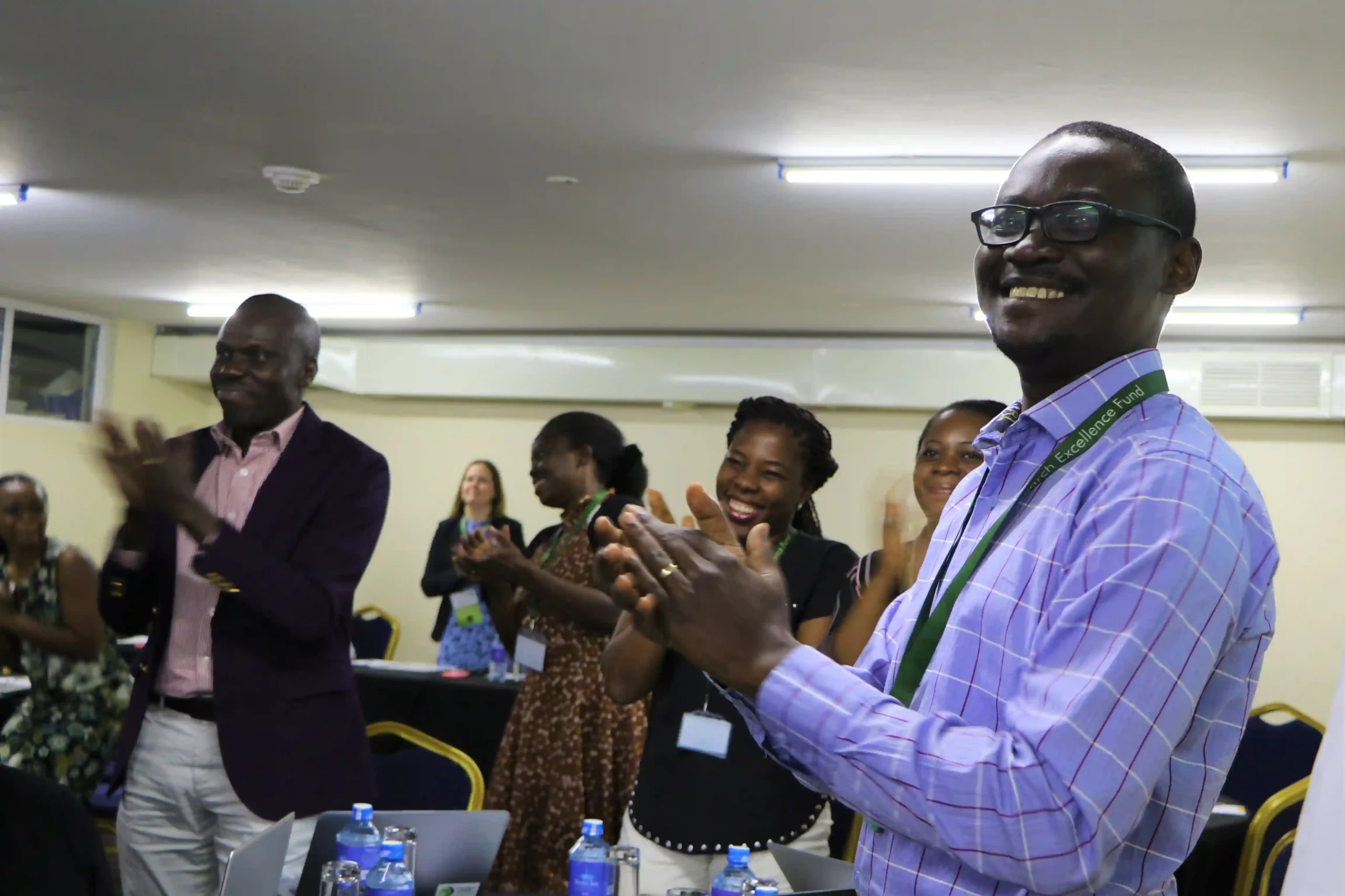 picture of people smiling and clapping